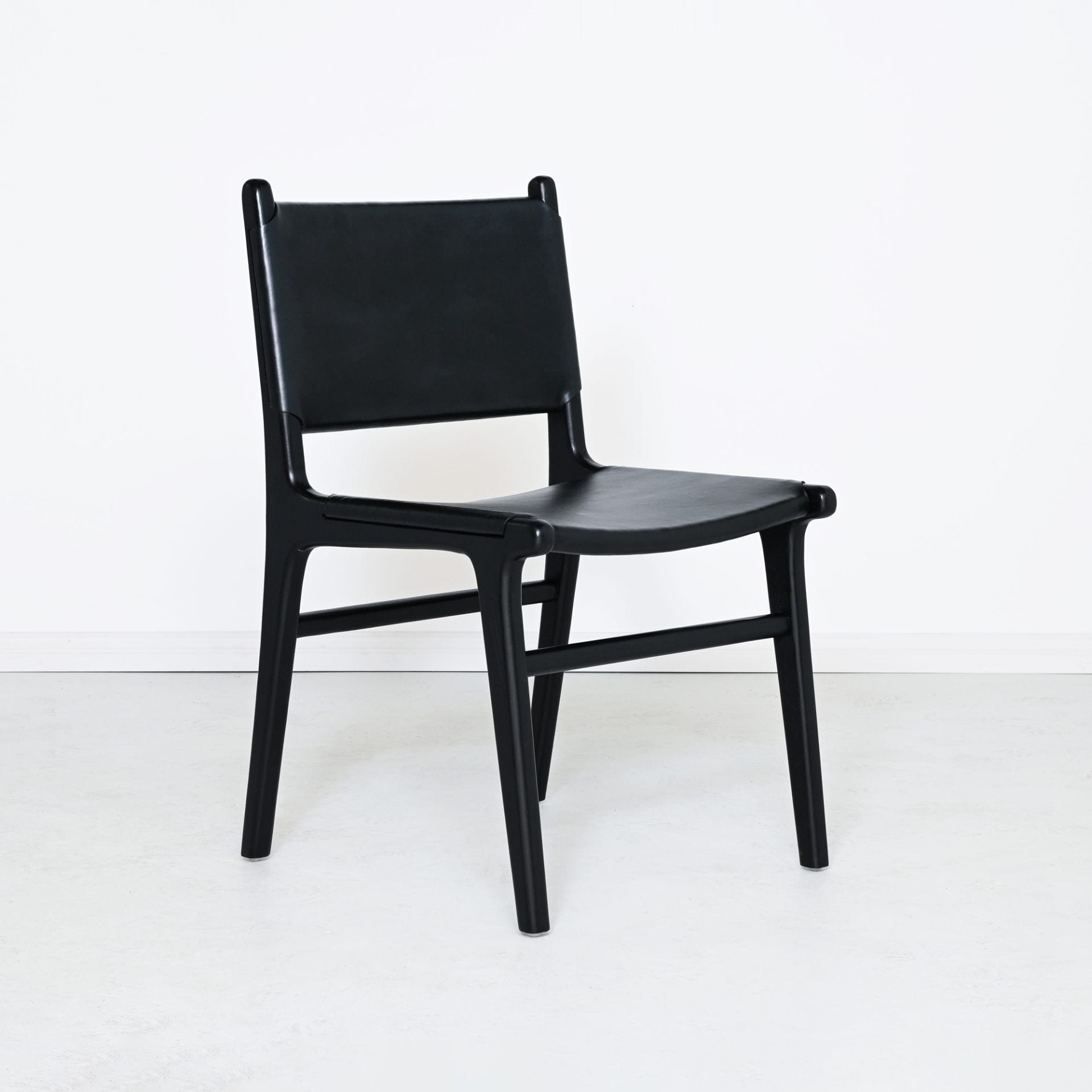 Black wood dining chair with leather seat