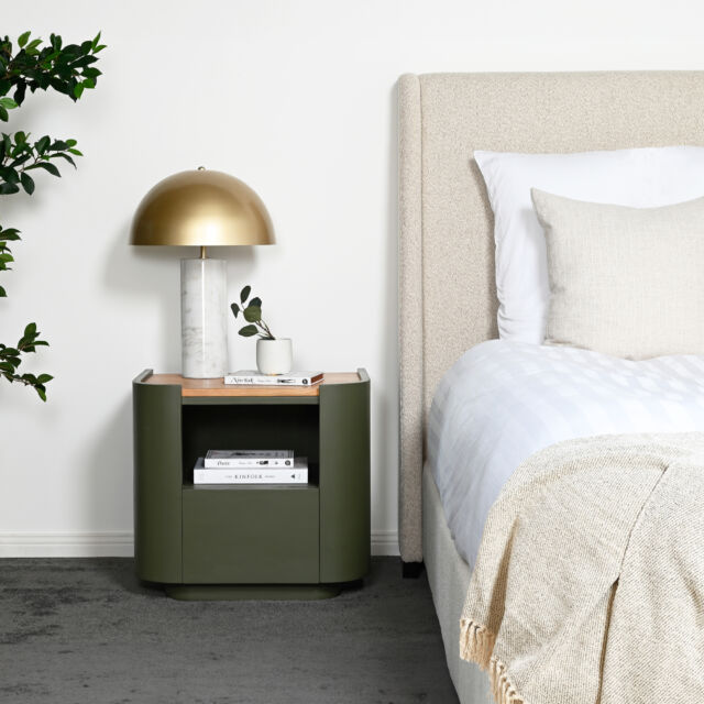 This well crafted wood bedside table has a rounded shape that blends well into its space. The olive green base is topped with a natural wood finish, to create a subtle contrast which compliments the overall design.#bedsidetable #bedsidetables #sidetable #homedecor #darcyandduke