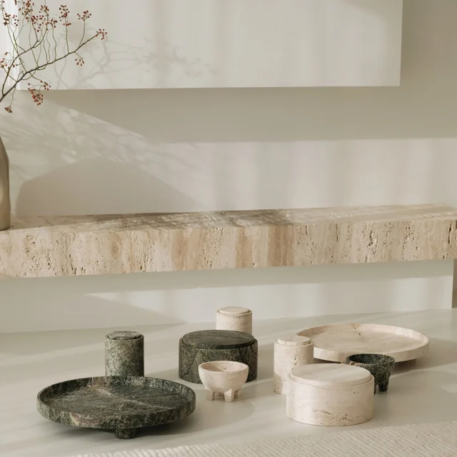 Our Namib objects are a concise collection of solid vessels crafted from travertine and green marble. These sculptural pieces bring depth and material contrast to a setting.
